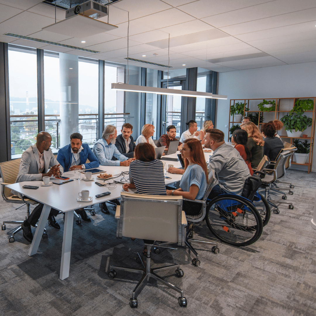 People at conference table Instagram without text 042224